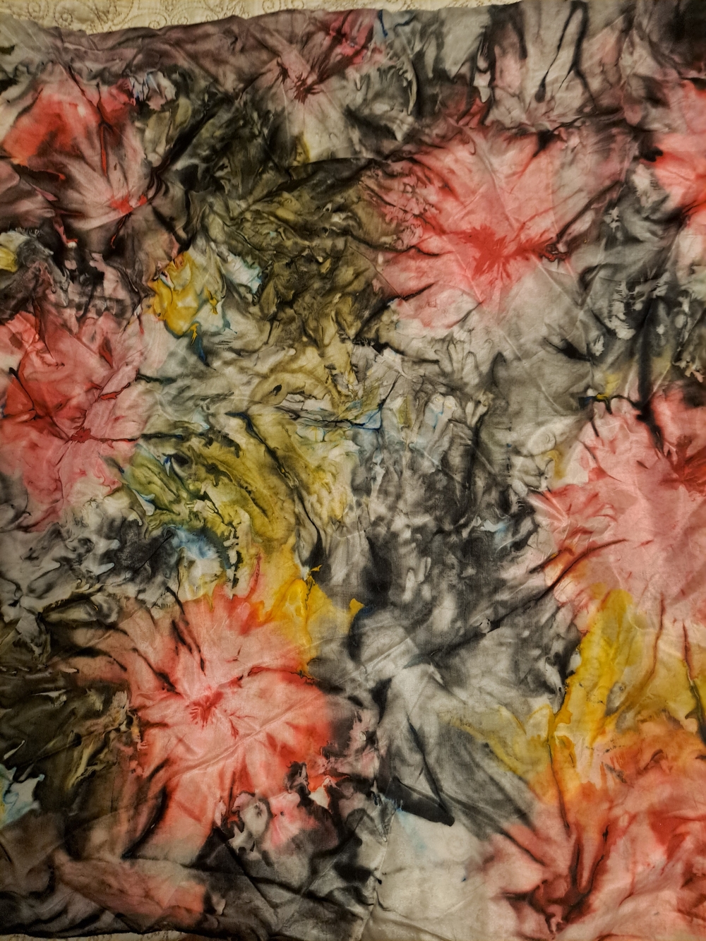 Luxurious 100% silk scarf with a multi-colored floral tie-dye pattern. This acce